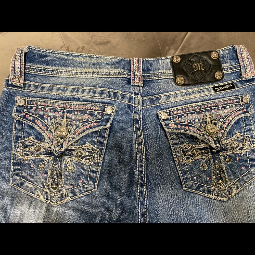 Pink Swarovski Crystal embellished Miss Me Jeans. Small stain on leg if jean .